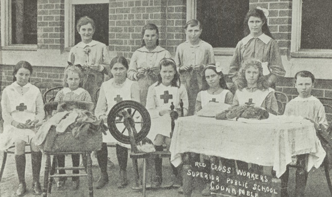 [Fig. 2] Red Cross workers at Coonamble Public School knitting and spinning, 1918. From NRS 15051.